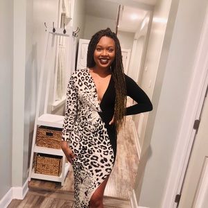 A half leopard half black dress, with a slit